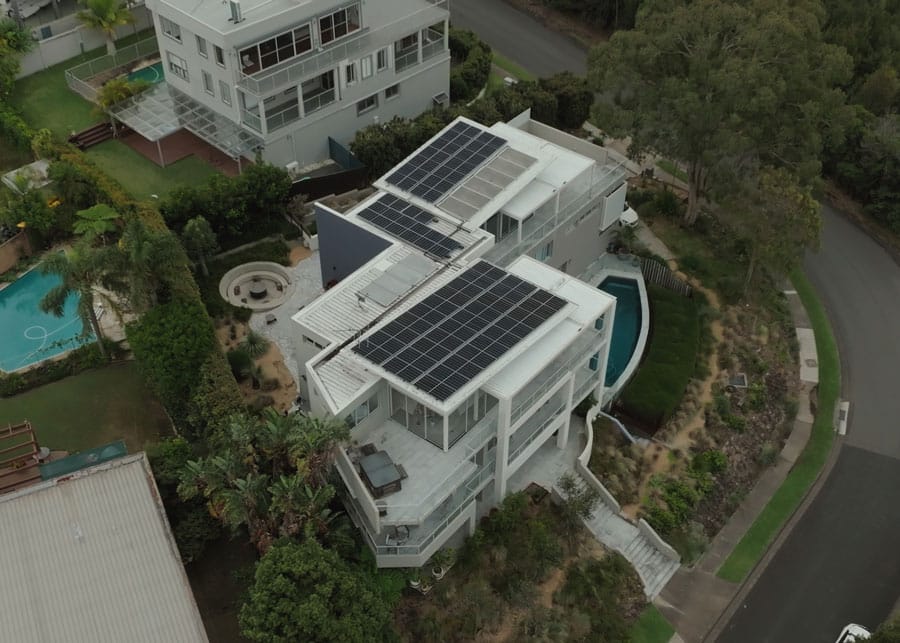 Rooftop solar on a clifftop home above the beach